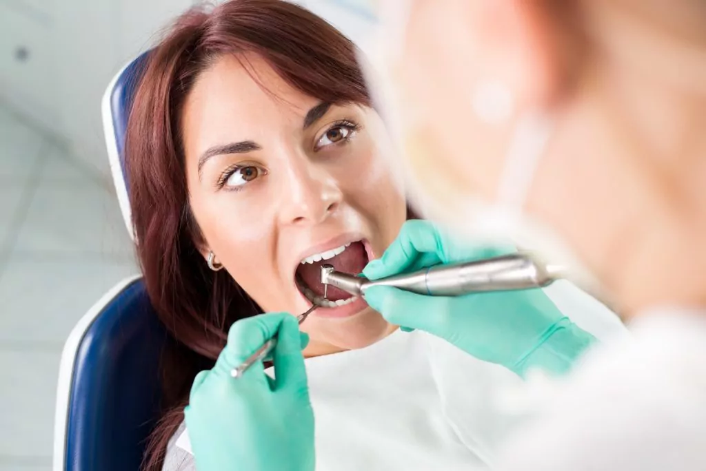 Dental treatment with dental drill