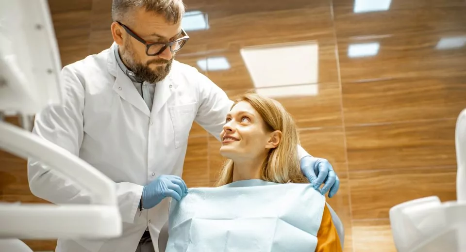 Dentist with patient at the dental office