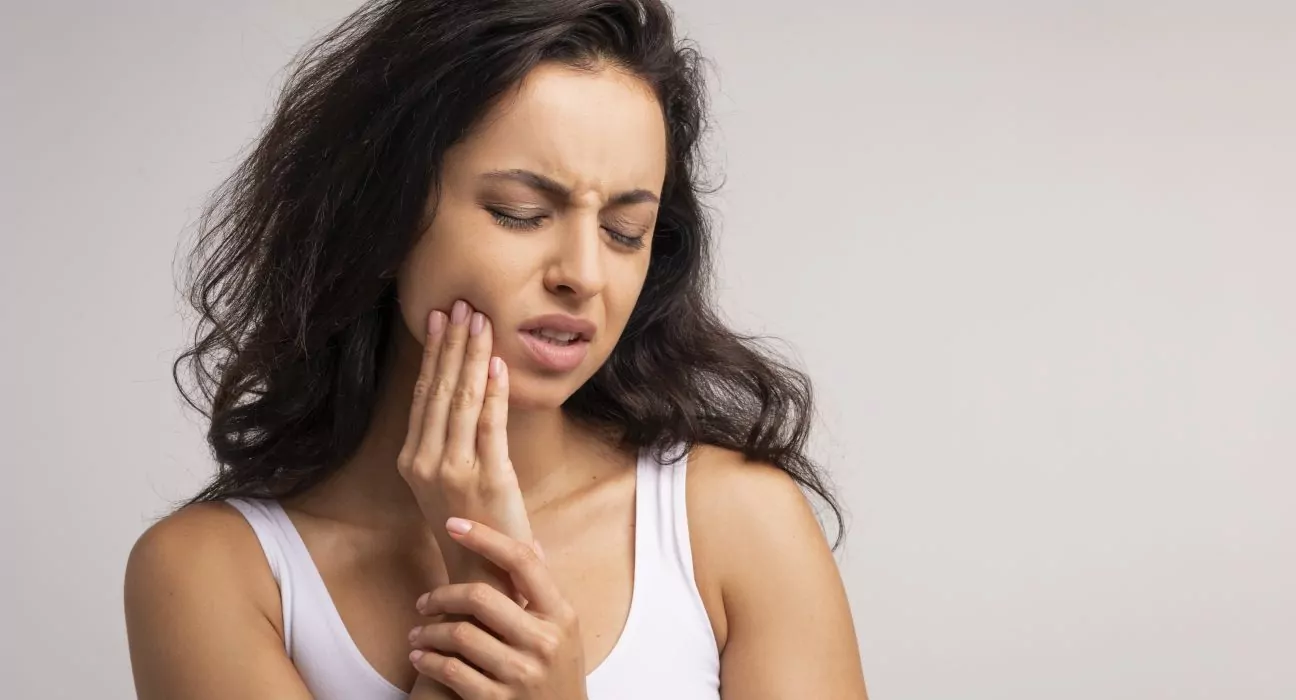 Upset millennial woman suffering from strong tooth pain