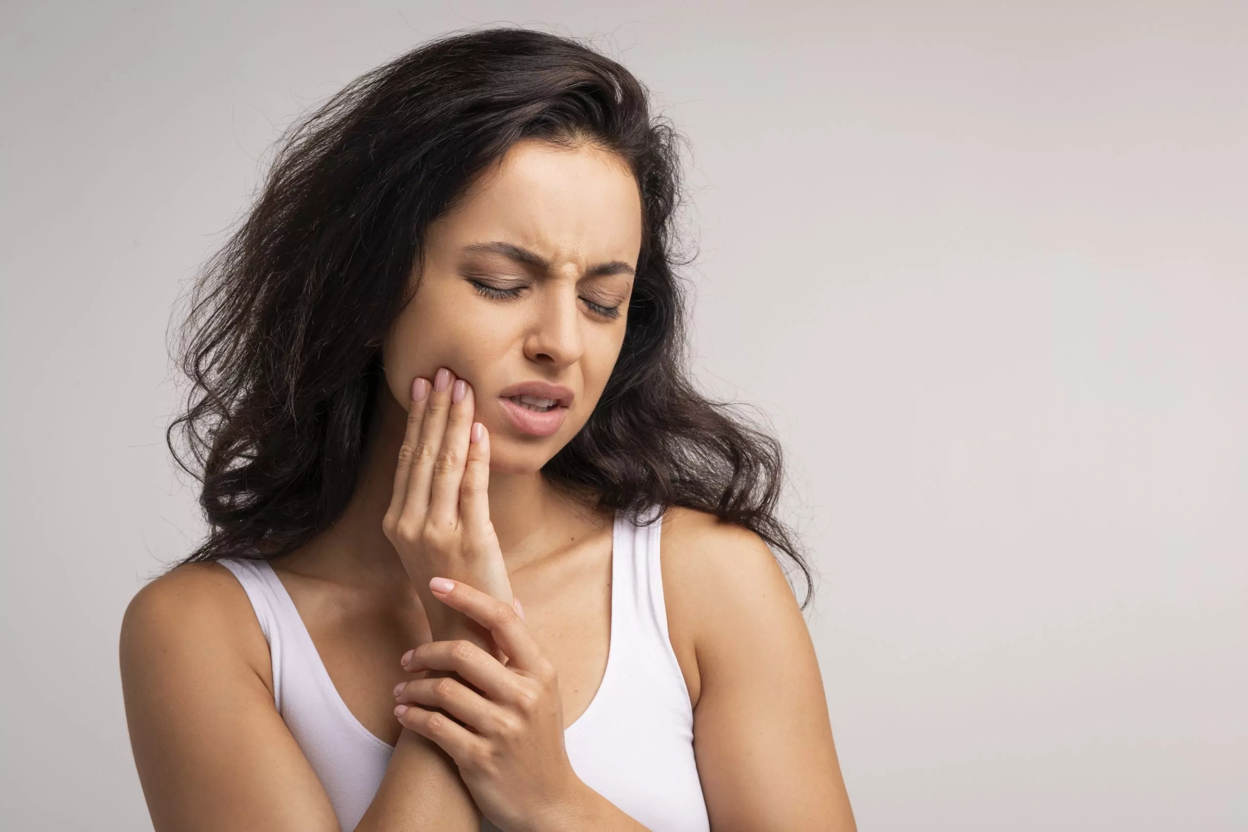 Upset millennial woman suffering from strong tooth pain