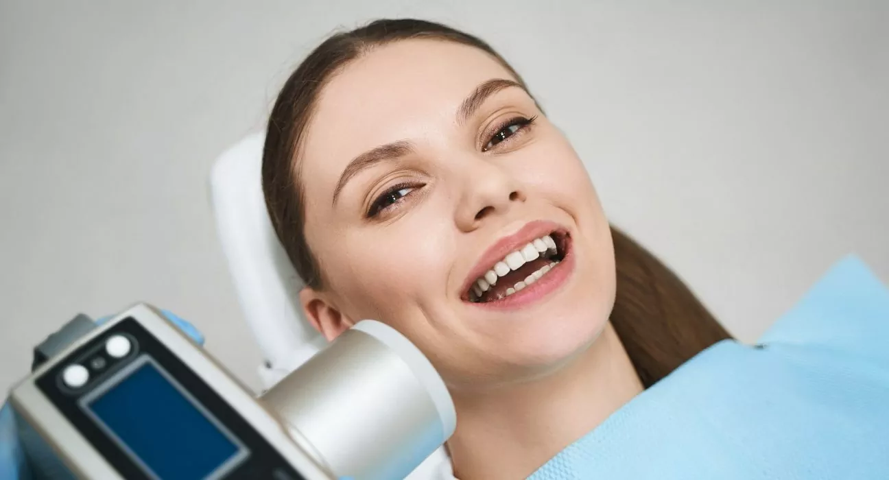 Joyful woman enjoying time at dentist stock photo