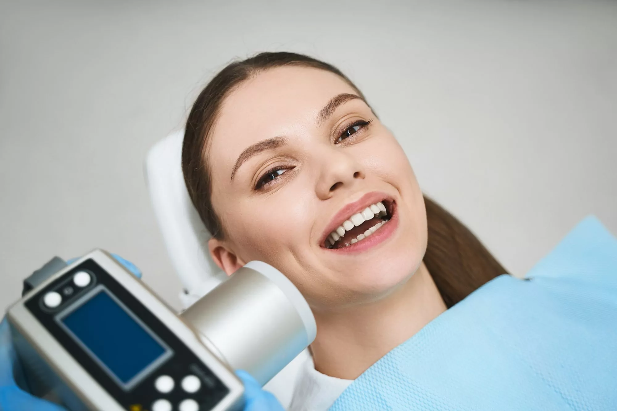 Joyful woman enjoying time at dentist stock photo